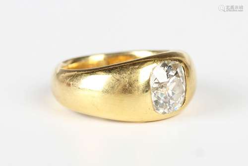 A gold and diamond single stone ring, gypsy set with a cushi...