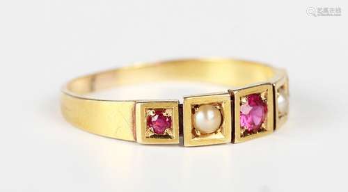 A gold ring, mounted with three cushion cut rubies alternati...