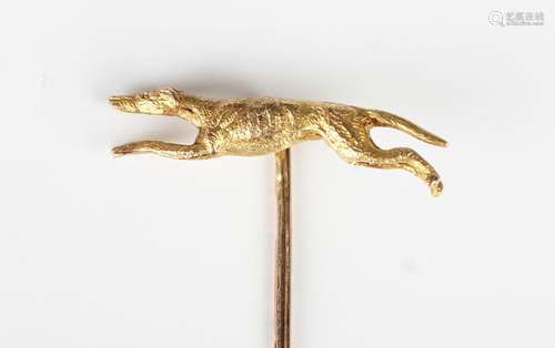 A 9ct gold stickpin, the finial designed as a running greyho...