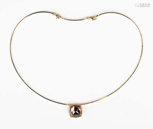 A Baccarat gold and smoky brown paste pendant necklace, the ...