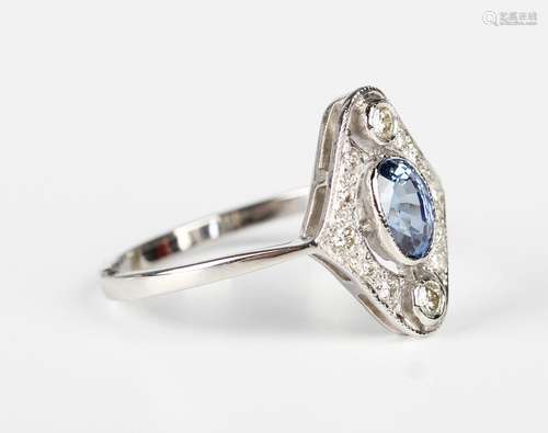 A platinum, sapphire and diamond ring in a lozenge shaped de...