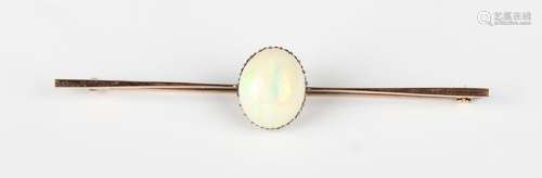 A gold and opal single stone bar brooch, claw set with an ov...