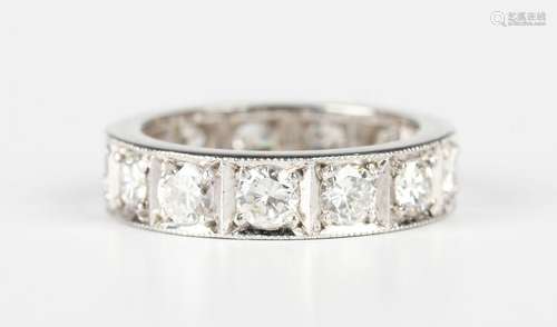 A platinum and diamond full eternity ring, mounted with thir...