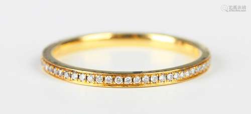 An 18ct gold and diamond full eternity ring, mounted with ci...