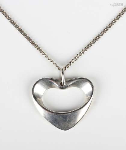 A Georg Jensen silver pendant in an open heart shaped design...