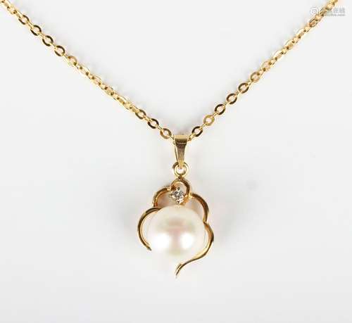 A gold, cultured pearl and diamond pendant, detailed '585 14...