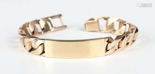 A 9ct gold faceted curblink identify bracelet with a curved ...