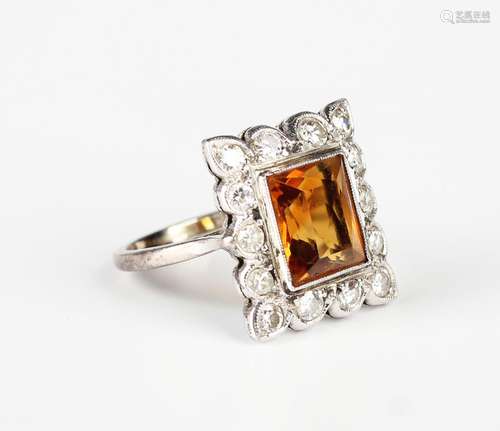 A diamond and citrine rectangular cluster ring, mounted with...