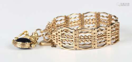 A 9ct gold twisted bar and curved bar link gate bracelet on ...