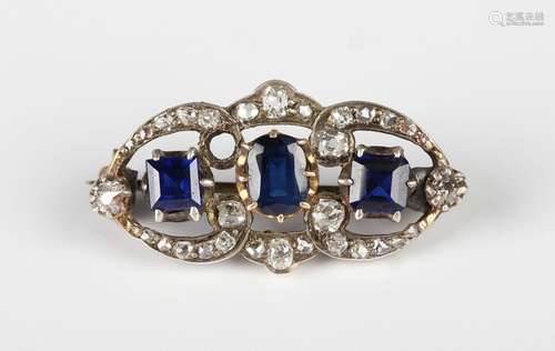 A diamond, sapphire and blue paste set brooch, claw set with...