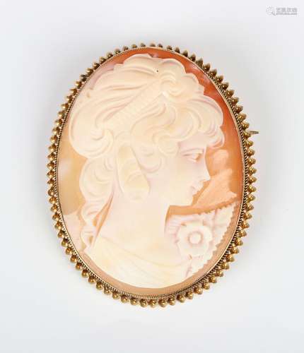 A 9ct gold mounted oval shell cameo brooch, carved as a port...