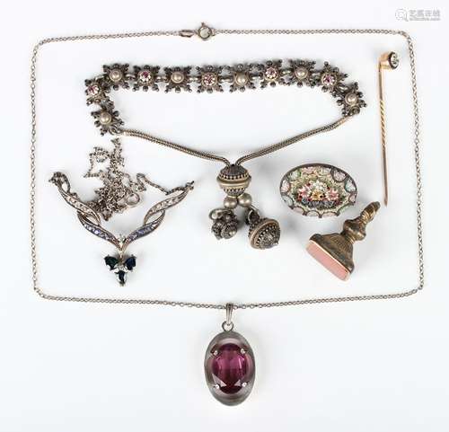 A Kordes & Lichtenfels silver and mauve paste oval penda...