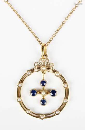 A gold, sapphire and seed pearl pendant, circa 1910, in a ci...