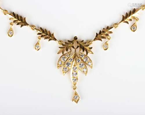 An Asian gold and colourless gem set necklace in a foliate d...