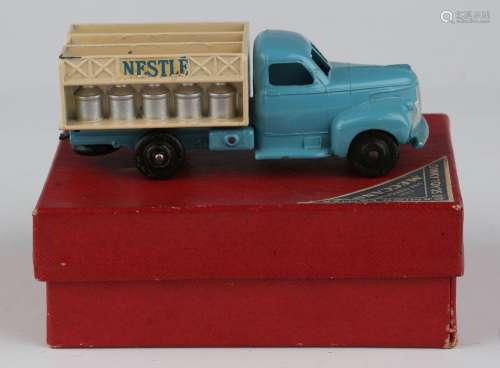 A French Dinky Toys No. 25-0 milk truck with blue cab, cream...