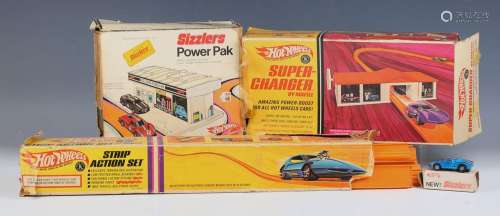 A Hot Wheels Sizzlers No. 6500 Ford MK IV, together with a p...