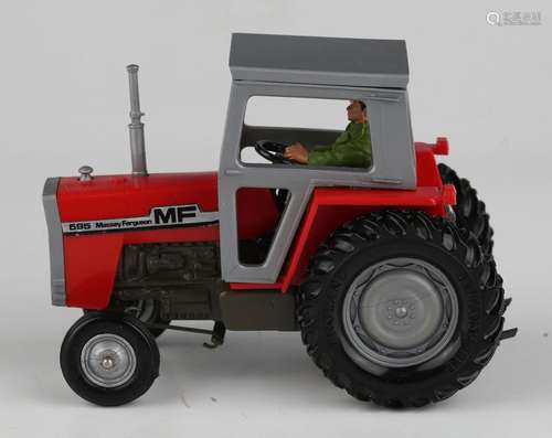 A Britains No. 9522 Massey Ferguson 595 tractor, within a wi...