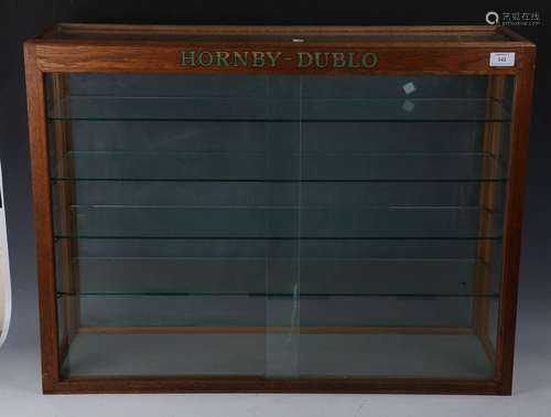 A Hornby Dublo oak and glazed shop display cabinet, fitted w...