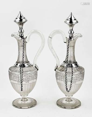 Two decanters with silverware