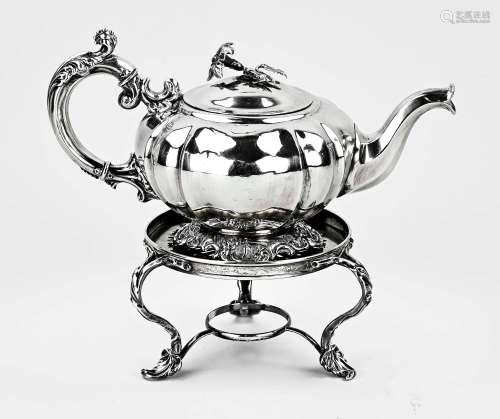 Silver teapot on stove