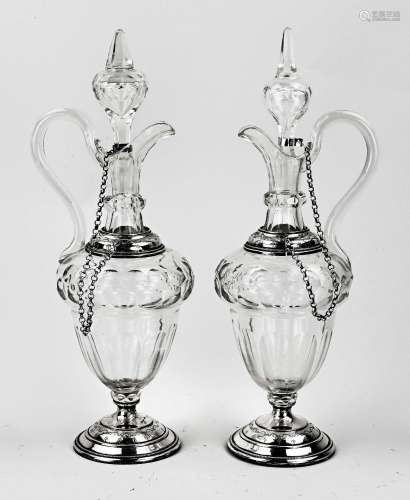 Two decanters with silverware