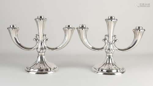 Two silver candlesticks