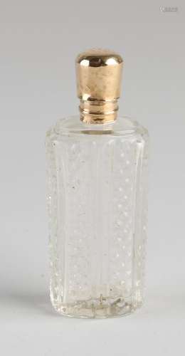 Odeur bottle with golden cap
