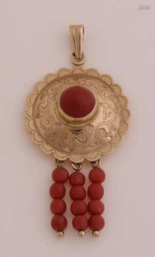 Gold pendant with red coral