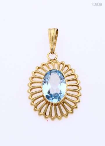 Gold pendant with blue stone