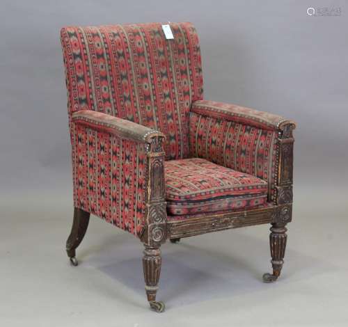 A William IV simulated rosewood library armchair, in the man...