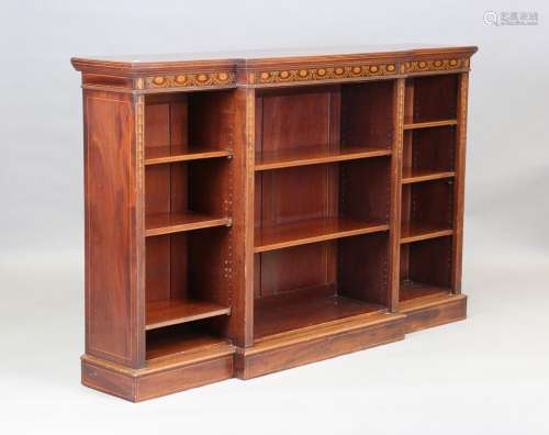 An Edwardian mahogany and line inlaid breakfront open bookca...