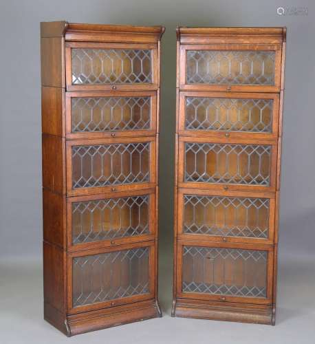 A pair of early 20th century oak Gunn patent sectional glaze...