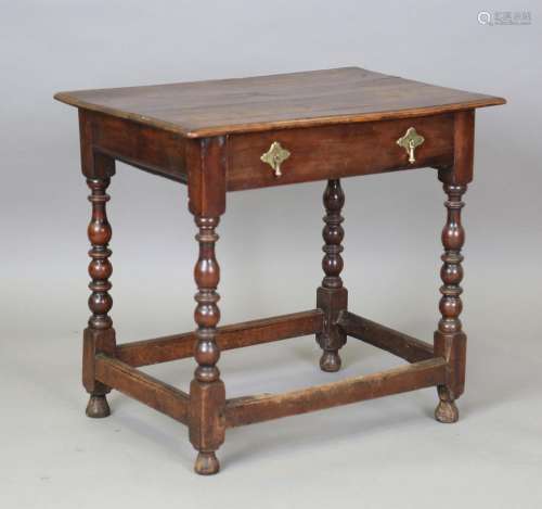 An early 18th century walnut side table, fitted with a singl...