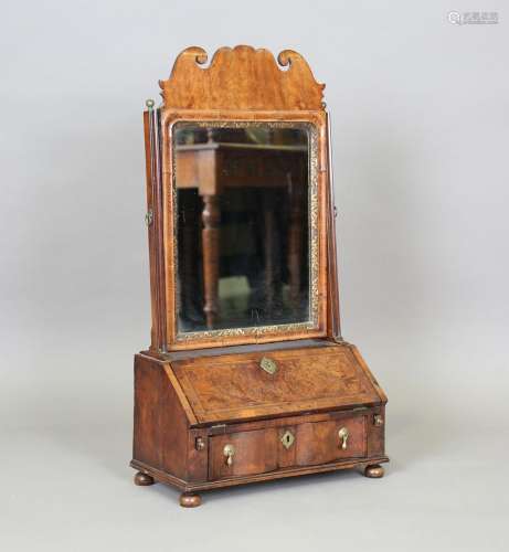 A Queen Anne walnut dressing table mirror, the base fitted w...