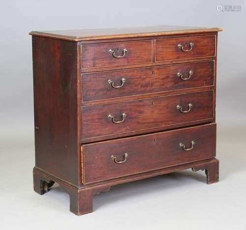 A George III mahogany chest of drawers with original brass h...