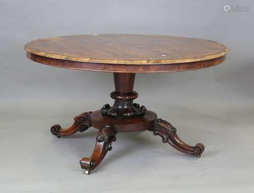 An early Victorian rosewood circular tip-top breakfast table...