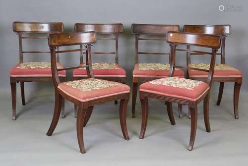 A set of six Regency mahogany bar back dining chairs with la...