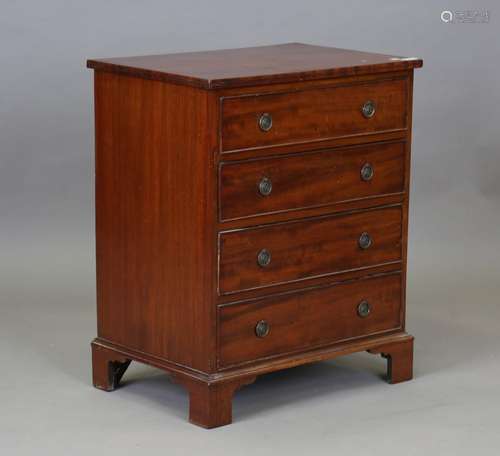 An early 20th century mahogany chest of four graduated long ...