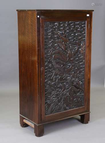 An early 20th century mahogany side cupboard, the door inset...