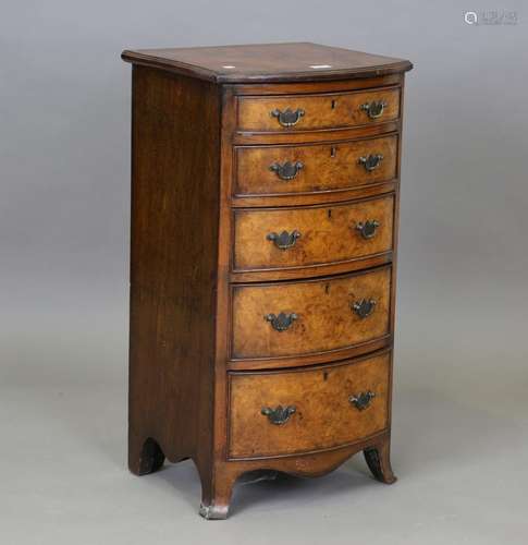 An early 20th century burr walnut bowfront chest of five gra...