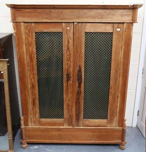 A late 19th/early 20th century French pine armoire, the door...