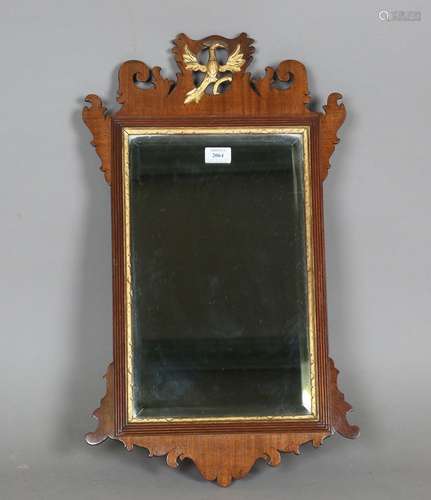 A 19th century mahogany and parcel gilt fretwork wall mirror...