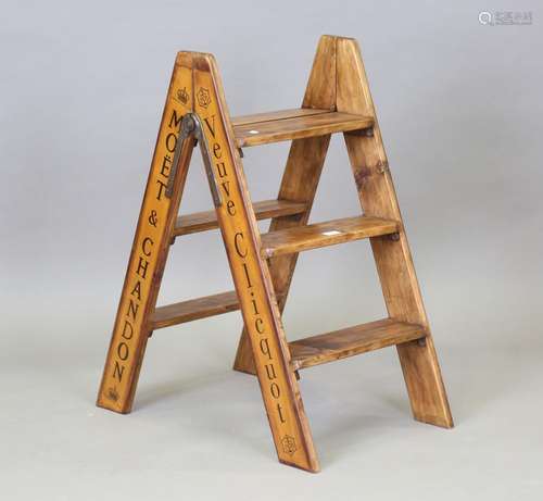 A set of late 20th century walnut folding steps, the sides s...