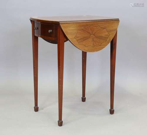 An early 20th century mahogany oval Pembroke table, the top ...