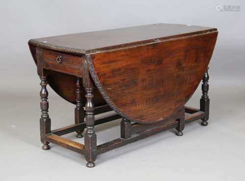 An early 18th century and later oak gateleg oval dining tabl...