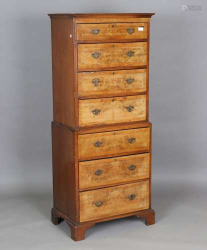 An early 20th century reproduction walnut tallboy, fitted wi...
