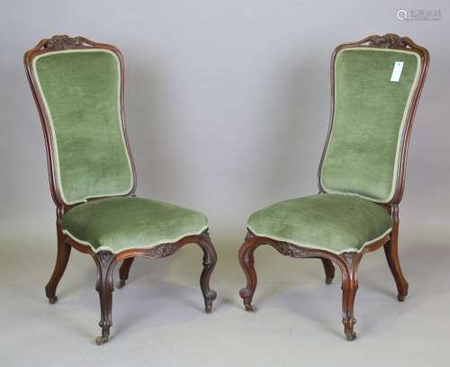 A pair of late 19th century rosewood showframe salon chairs ...