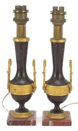 Pair of French patinated bronze and ormolu candlesticks conv...