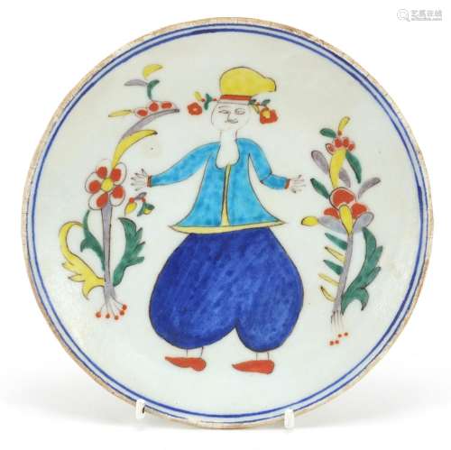 Turkish Kutahya pottery plate hand painted with a figure, 16...