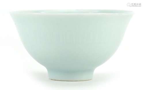 Chinese porcelain tea bowl having a celadon glaze, four figu...